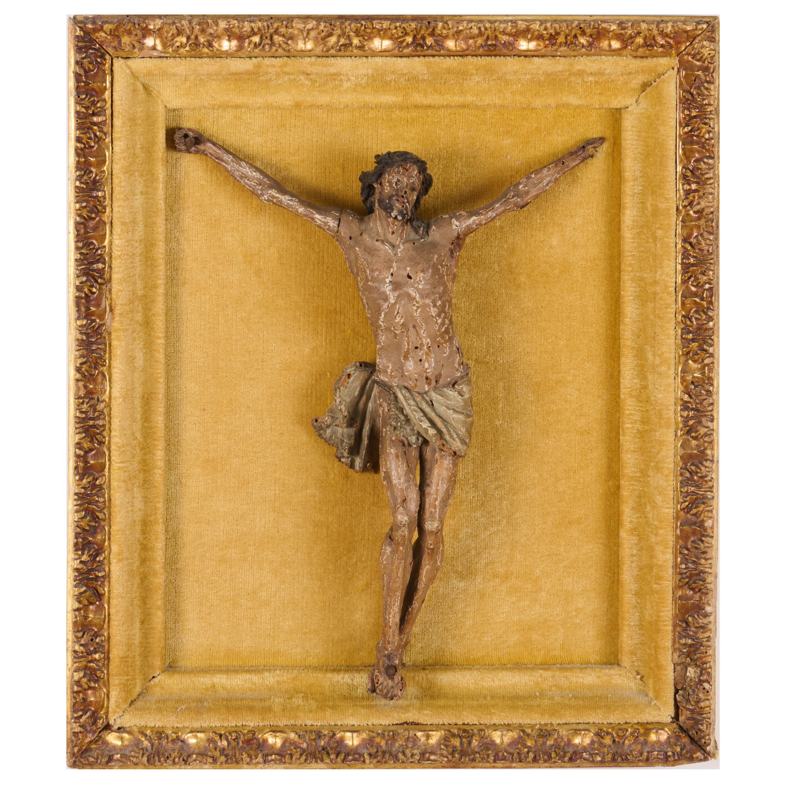 Carved Wood Figure Of The Crucifixion Mounted In A Velvet Lined Giltwood Frame: Carved Wood Figure Of The Crucifixion Mounted In A Velvet Lined Giltwood Frame 18 x 15 1/2 in. frame.