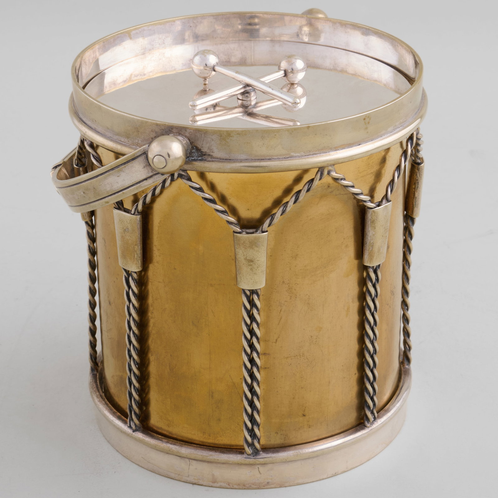 English Silver Plate and Parcel Gilt Drum Form Biscuit Box: English Silver Plate and Parcel Gilt Drum Form Biscuit Box 6 1/8 x 5 1/2 in. diam. The Collection of James M. Labaugh Antiques, Pound Ridge, NY.