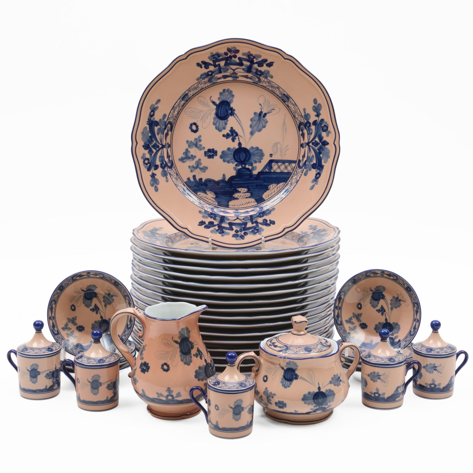 Ginori Part Porcelain Service in the 'Oriente Italiano Azalea' Pattern: Ginori Part Porcelain Service in the 'Oriente Italiano Azalea' Pattern Green and blue printed marks.Comprising:Seventeen dinner platesTen pot-de-creme and covers, and eight saucersA sugar bowl an