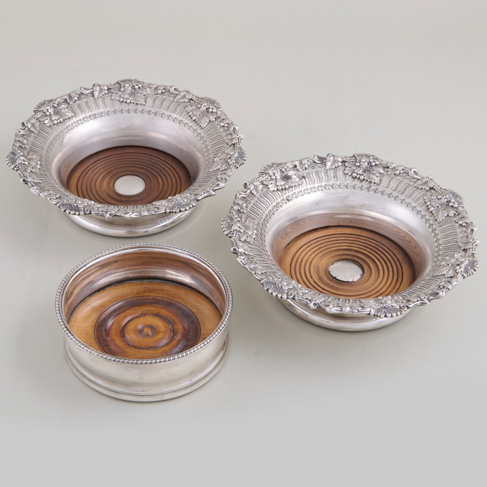 Group of Three Silver Coasters and a Pair of Silver Plate Bottle Coasters: Group of Three Silver Coasters and a Pair of Silver Plate Bottle Coasters Comprising:A small pair of coin silver William Gale & Son coasters, stamped marks and monogrammed An English silver coaster, i