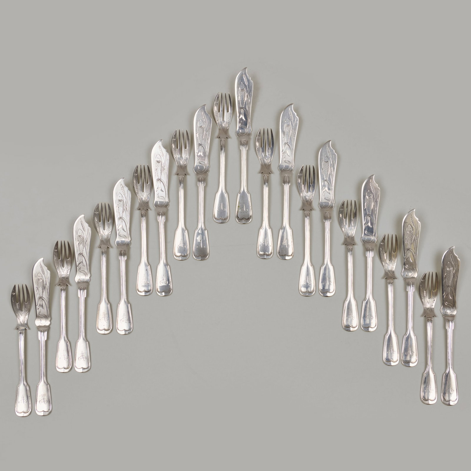 German Silver Fish Service: German Silver Fish Service Marked '.800'; monogrammed.Comprising:Eleven forksEleven knivesThe forks 7 in. long, the knives 8 1/4 in. long, 34.2 oz. approx. weight, (22 pcs). The Colle