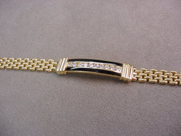 14K GOLD BLACK ONYX AND CLEAR STONE BRACELET