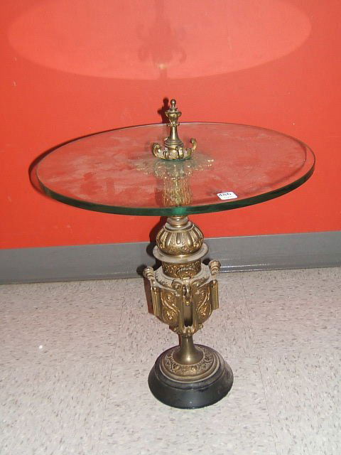 GLASS TOP TABLE WITH ORNATE METAL BASE: GLASS TOP TABLE WITH ORNATE METAL BASE - 19" HIGH, 18" DIA