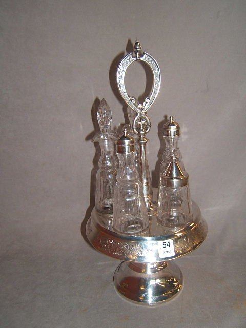 REED & BARTON CASTOR SET WITH CUT GLASS BOTTLES