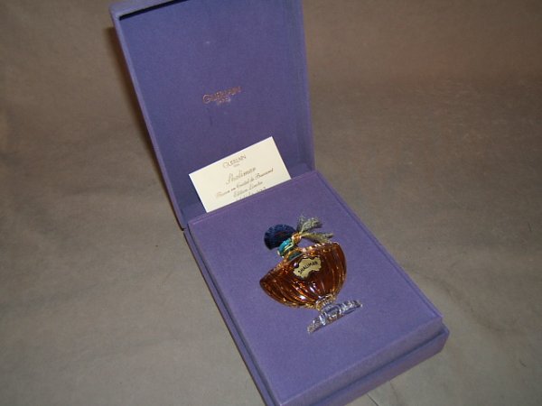 LTD. ED. BACCARAT CRYSTAL FLACON OF SHALIMAR: LIMITED EDITION BACCARAT CRYSTAL FLACON #1446/2000 OF SHALIMAR - Made for Guerlain. Crystal with blue collar & blue stopper that reads Guerlain, Paris with Shalimar on front. 1 1/4 fluid oz. Lavender