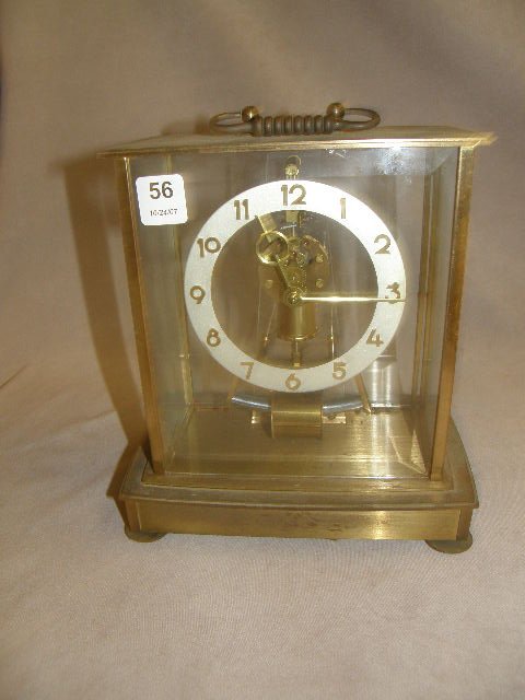 GERMAN CLOCK IN BRONZE AND BEVELED GLASS CASE