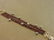 1083: GARNET AND GREY BAROQUE PEARL BRACELET