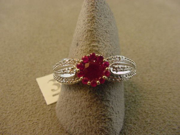 10K GOLD RUBY AND DIAMOND RING: 1 10K GOLD RING SET WITH RUBIES & DIAMONDS SIZE 7 1/4 - GRAM WEIGHT: 3.4