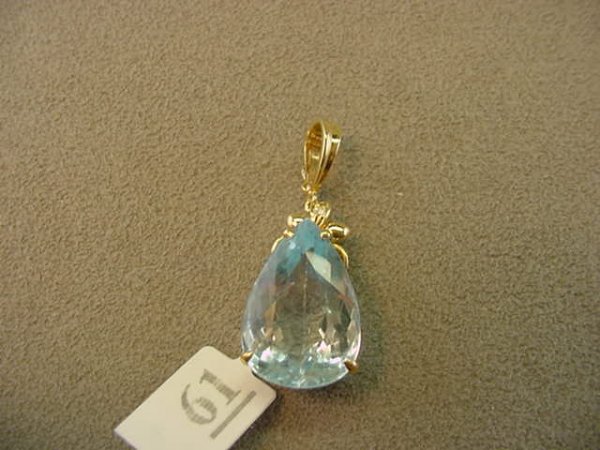 14K GOLD HINGED BLUE TOPAZ AND DIAMOND PENDANT