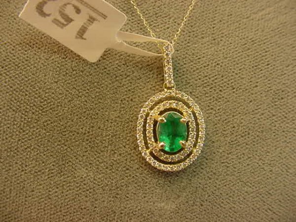 14K GOLD EMERALD AND DIAMOND PENDANT