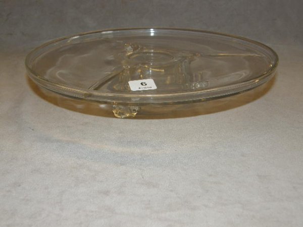 ANTIQUE CLEAR GLASS CAKE STAND WITH FIGURAL FEET