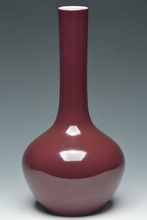 An Imperial Bottle Vase, Qianlong Mark and Period: An Imperial Ruby Enamelled Bottle Vase, Qianlong Mark and Period. With original Christie's label on it. Size: 9" H x 4 1/2" W. Provenance: Former S. Byrne(1918-1996) collection, NY and acquired 1970's