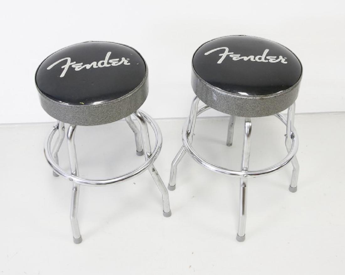 Fender Guitar Bar Stools: Two Fender Chrome & Black Vinyl Bar Stools. 24" H Est weight: 24 lbs for both.