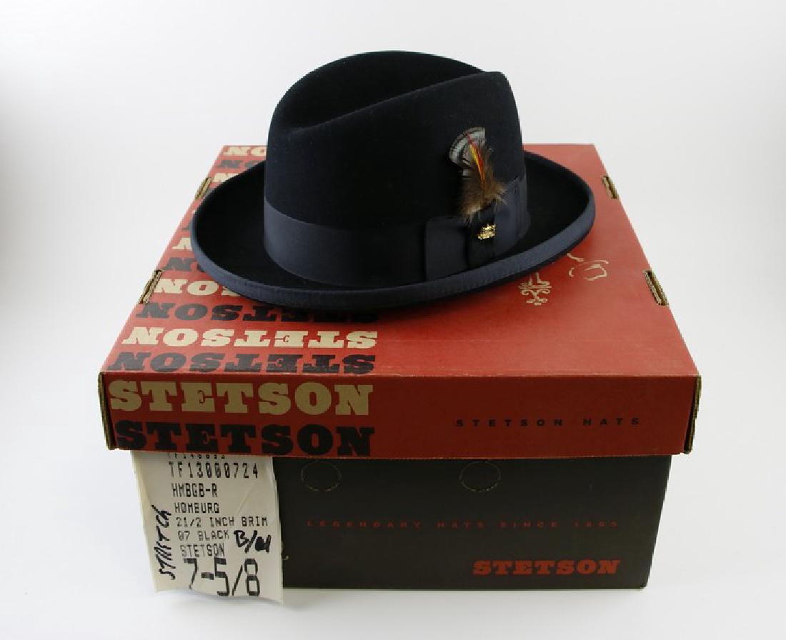 Hat - Stetson Fedora Black Hat: This Stetson Fedora is made of Premium Wool Felt, with a Grosgrain Ribbon Band and Embellished with Stylish Feather and Gold Stetson Emblem. 7 5/8, 21/2 Brim. Est weight 2 lbs,
