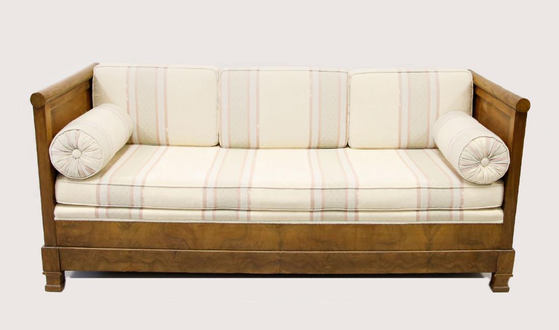 Biedermeier - Continental Mahogany Sofa / Daybed: Cylindrical arm rest with square straight stiles, square feet, mahogany apron, paneled ends and upholstered back. Daybed folds down with bolster pillows with red cream silk upholstery. 6' X 27" 1/2 D 