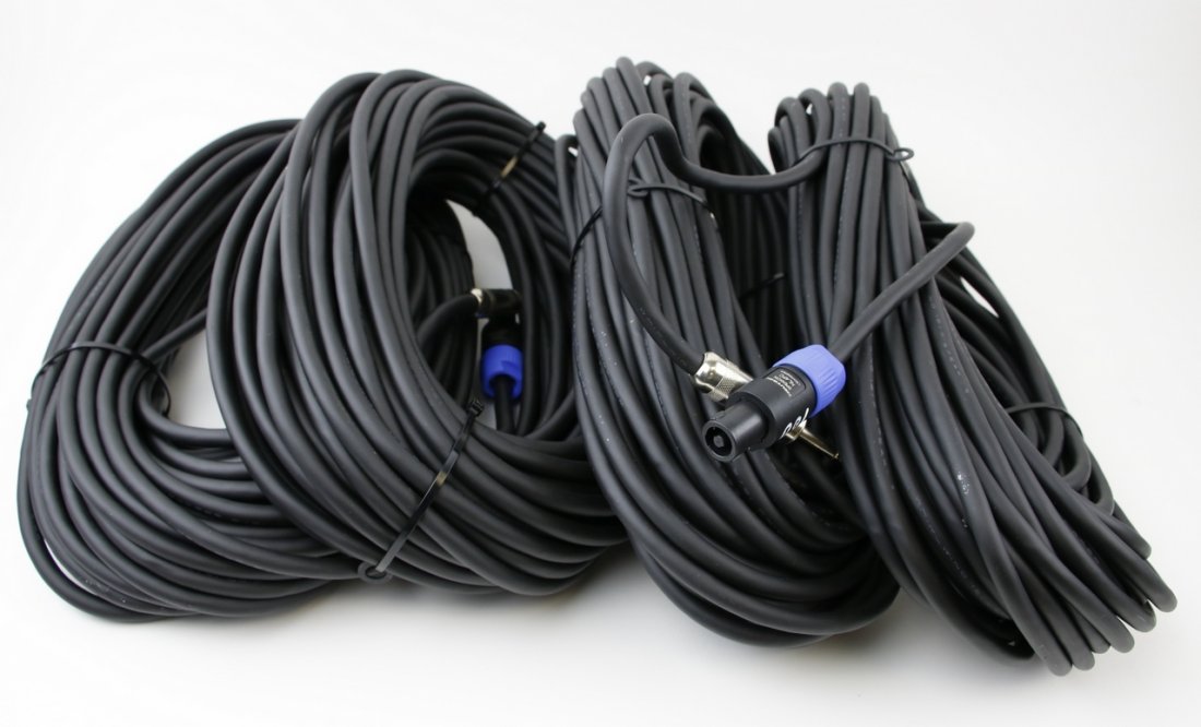 Whirlwind 100 Feet Speaker Cables (4): Four Whirlwind 100 Feet SK2 Series speaker cables made from 12GA wire, terminated with an NL4 and a large barrel 1/4" plug. Wiring is tip to 1+ and shield to the 1- pins of the NL4 connector. Est weig