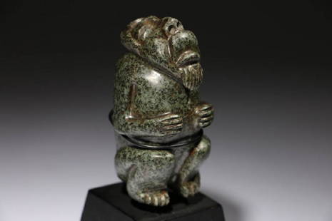 Pre-Columbian Stargazer: A pre-Columbian stargazer, beautifully carved serpentine stone. Face gazing at the sky, arms at chest, in sitting position. Display stand included. Dimensions: 3-1/2" H; Weight: 14 lbs.