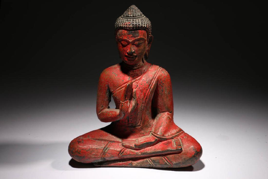 Small Wood Buddha: Wood Buddha painted red, seating in classic mediation position, ca. 19th - 20th century. Dimensions: 7" H; Weight: 9 oz. Provenance: Ex. B. Cerevas collection.