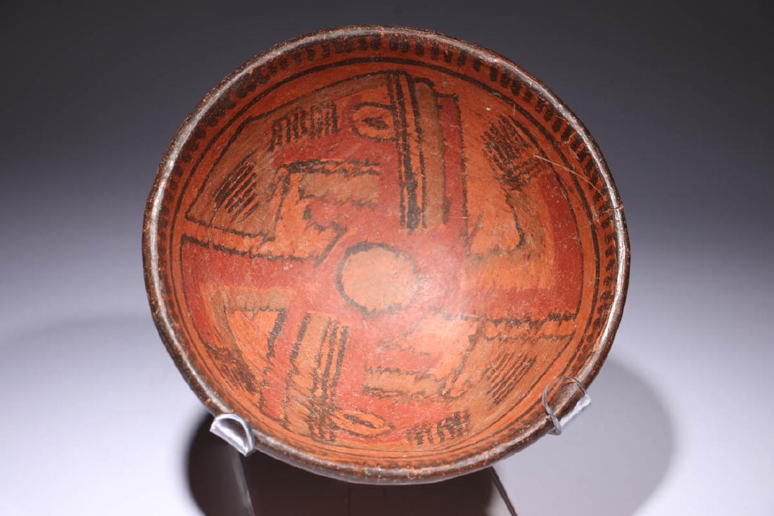 Pre-Columbian Mayan Bowl: A Mayan bowl with abstract bird design in interior, line design on outer shoulder. Short pedestal base. Dimensions: 6-3/4' dia. X 3" H; Weight: 1 lb. 1 oz. Provenance: Ex. Private collection, New York
