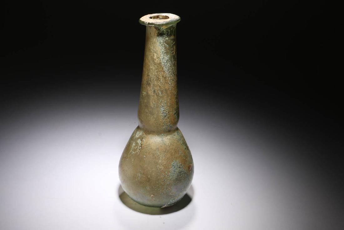 Ancient Roman Glass: Ancient Roman glass bottle, circa 200AD, Bulbous bottom with long tapered neck leading to an applied rim. Great iridescent and encrusted. Dimensions: 6-1/4" H; Weight: 2.5 oz. Provenance: Ex. Private