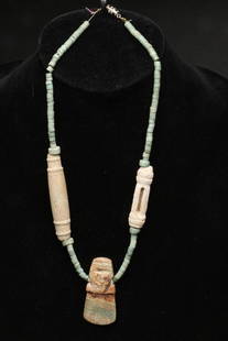 Pre-Columbian Stone Necklace: Pre-Columbian stone necklace with pendant, costa Rica, ca. 200 - 600 A.D., jadeite and stone beaded necklace with a avian pendant. Large tubular beads, one with a slit. Dimensions: 19" L Provenance; E