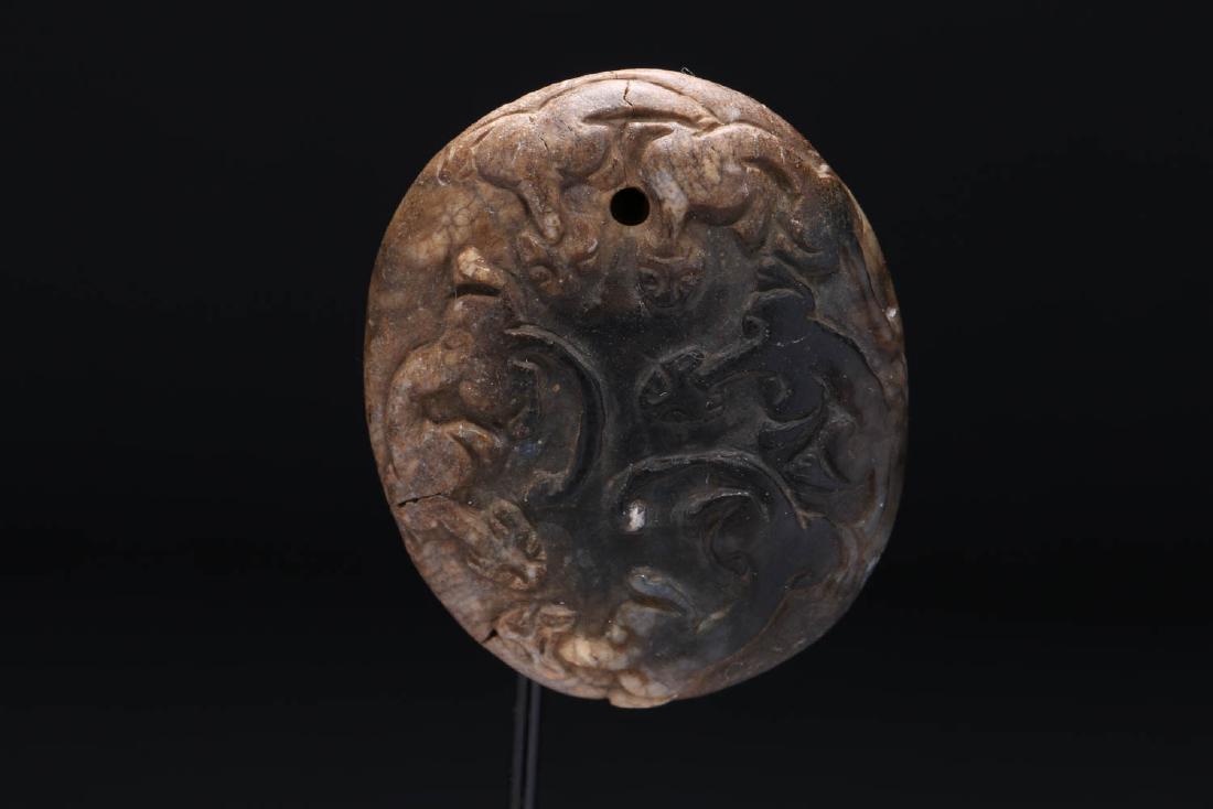 Chinese Pendant: A soapstone pendant with carved cat figures, suspension hole, 19th century. Dimensions: 1-7/8" L x 1-5/8" W