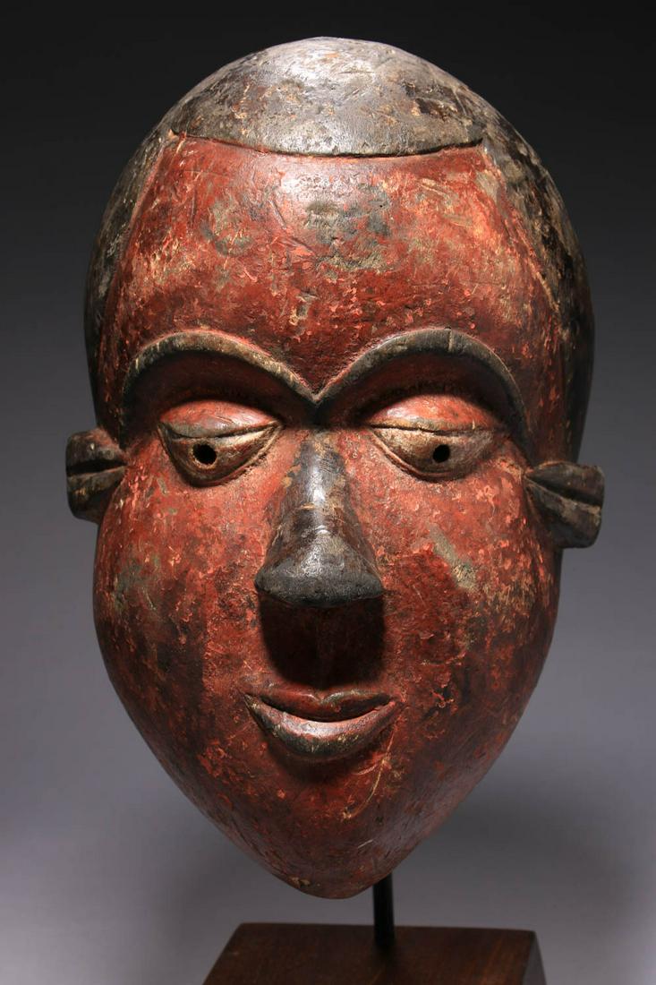 African Art Mask: A Nigerian wood mask, polychrome, nice age. 12" L