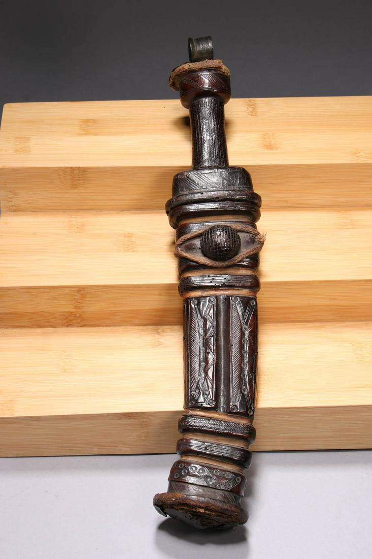 African Art Knife: A beautifully sheathed metal knife with leather. 14" L total.