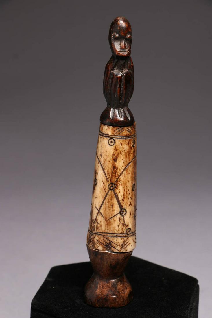 African Container: A wood and bone container, with kneeling wood figure. 6 H "
