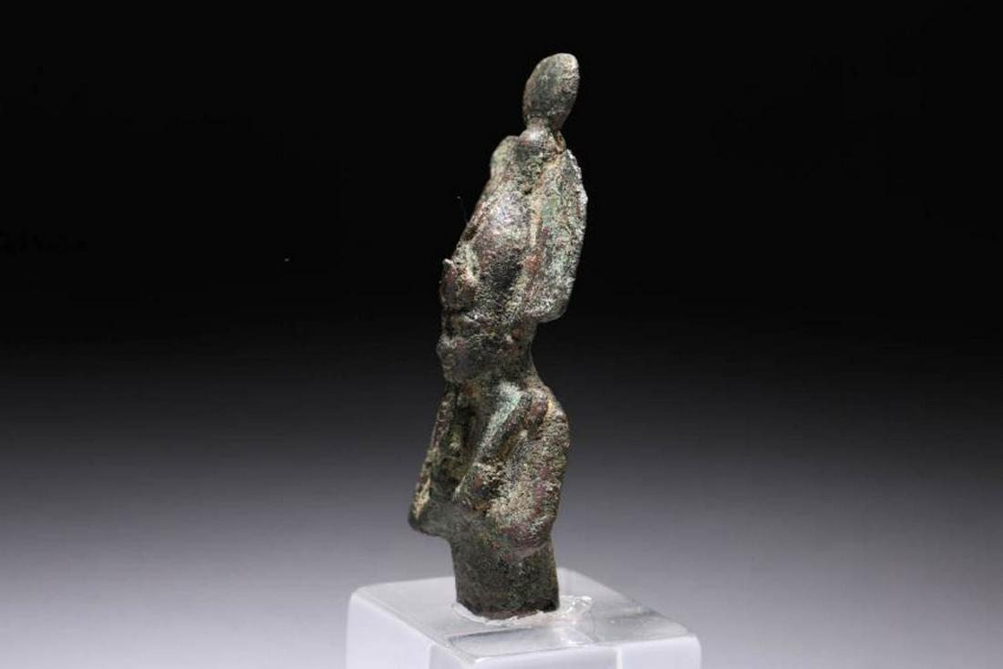 Ancient Egyptian Bronze Osiris: A detailed bronze upper body of Osiris, ca. late period, a detailed figurine depicted mummiform and wearing Atef crown with uraeus and false beard, clasping a crook and flail to his chest. Attractive 