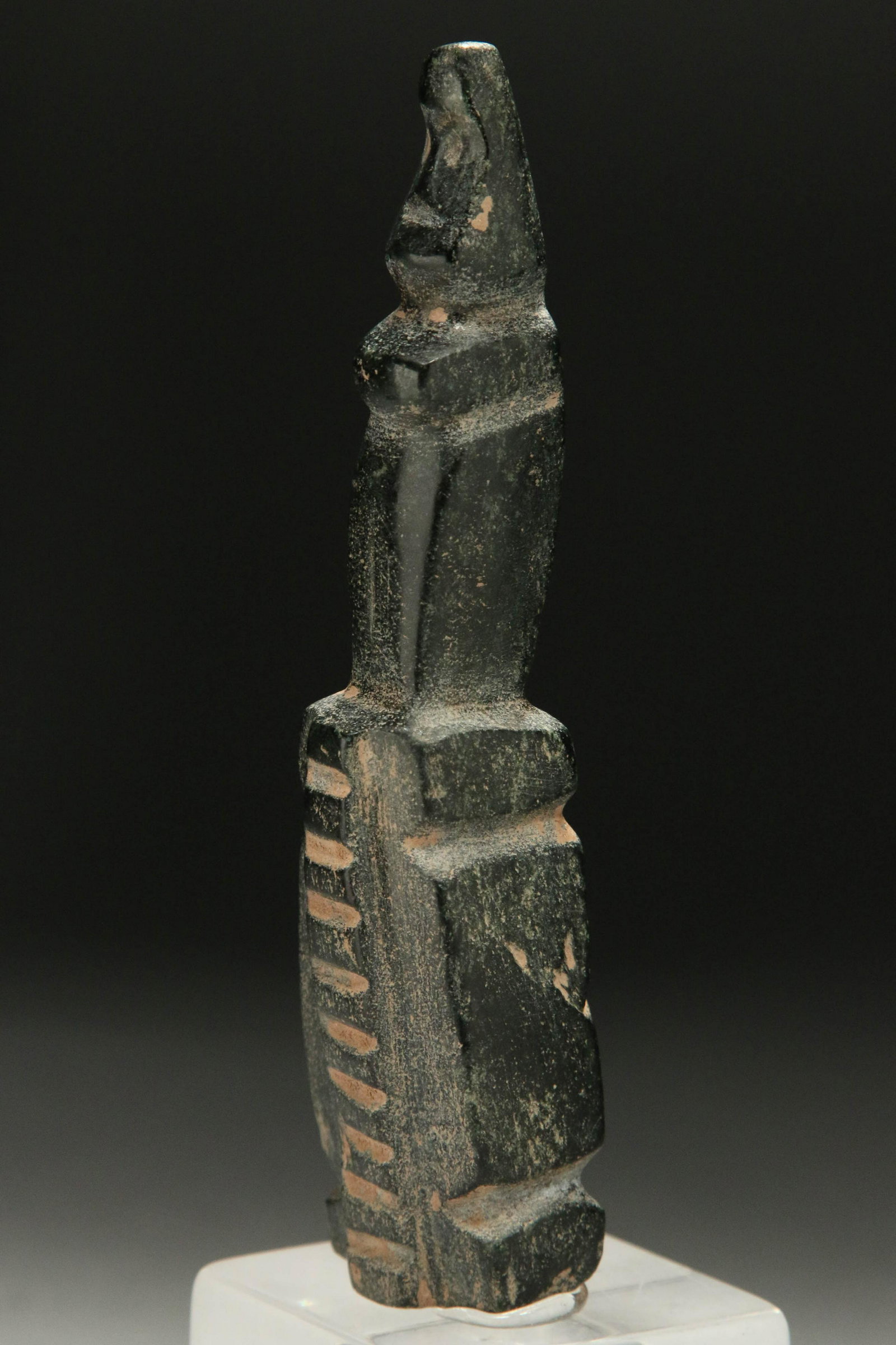 Pre-Columbian Stone Statuette: A stone statue of an anthromorphic figure seating on top of a pedestal. 5-1/2 H "