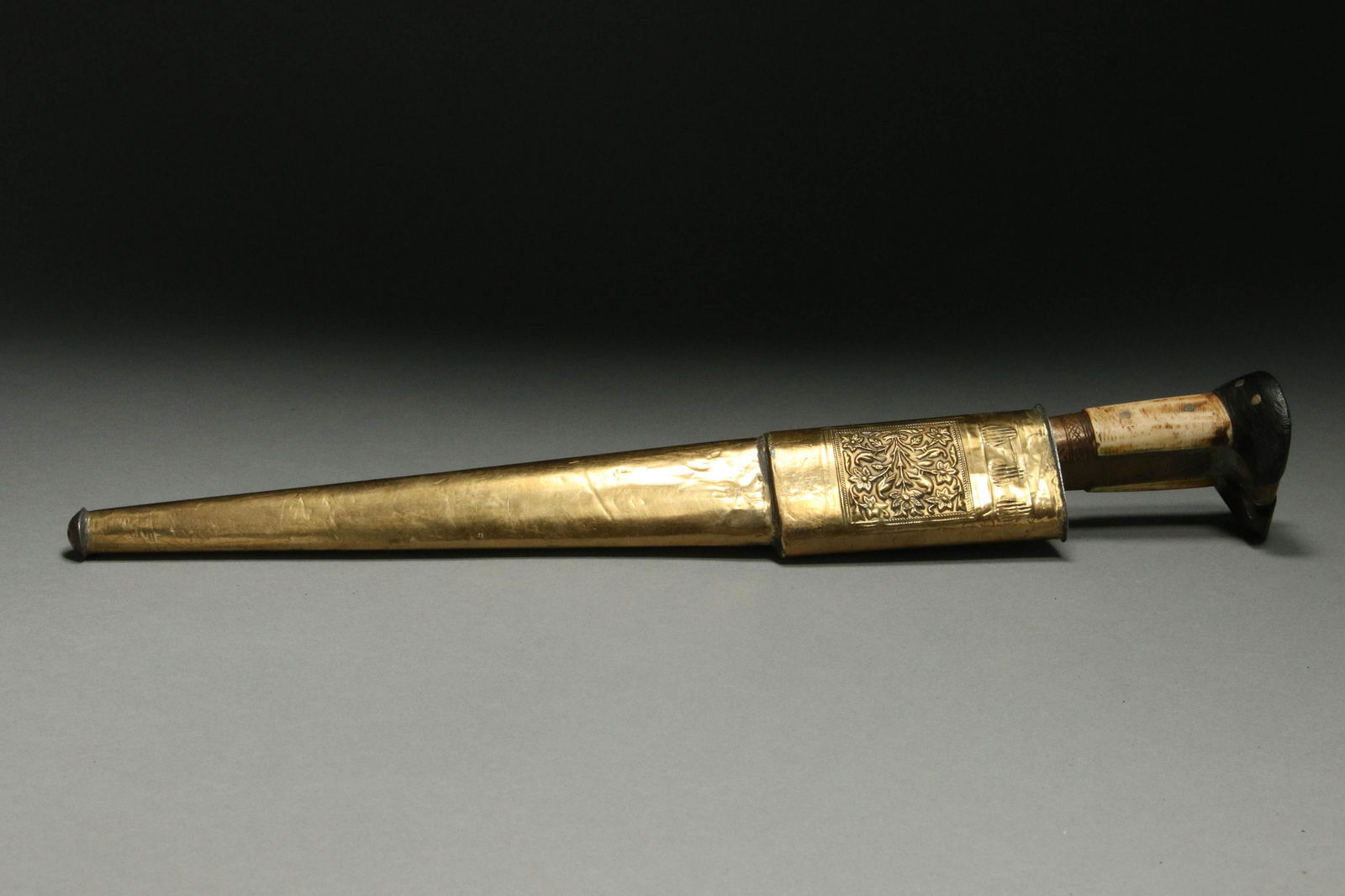 Afghanistan Khyber Knife: A Khyber knife, bone and wood handle, yellow metal sheath. 15" L