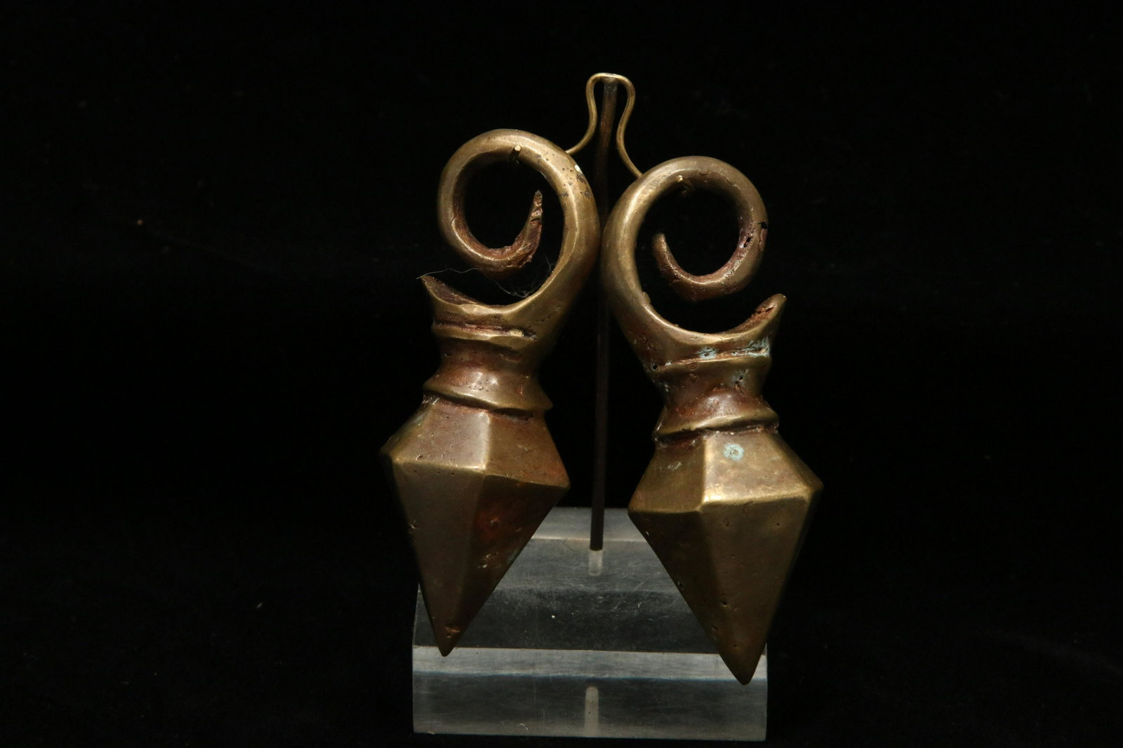 Indonesian Batak Earrings: A pair of large bronze earrings with spiral loops, and triangular bottoms. 3-1/4" L