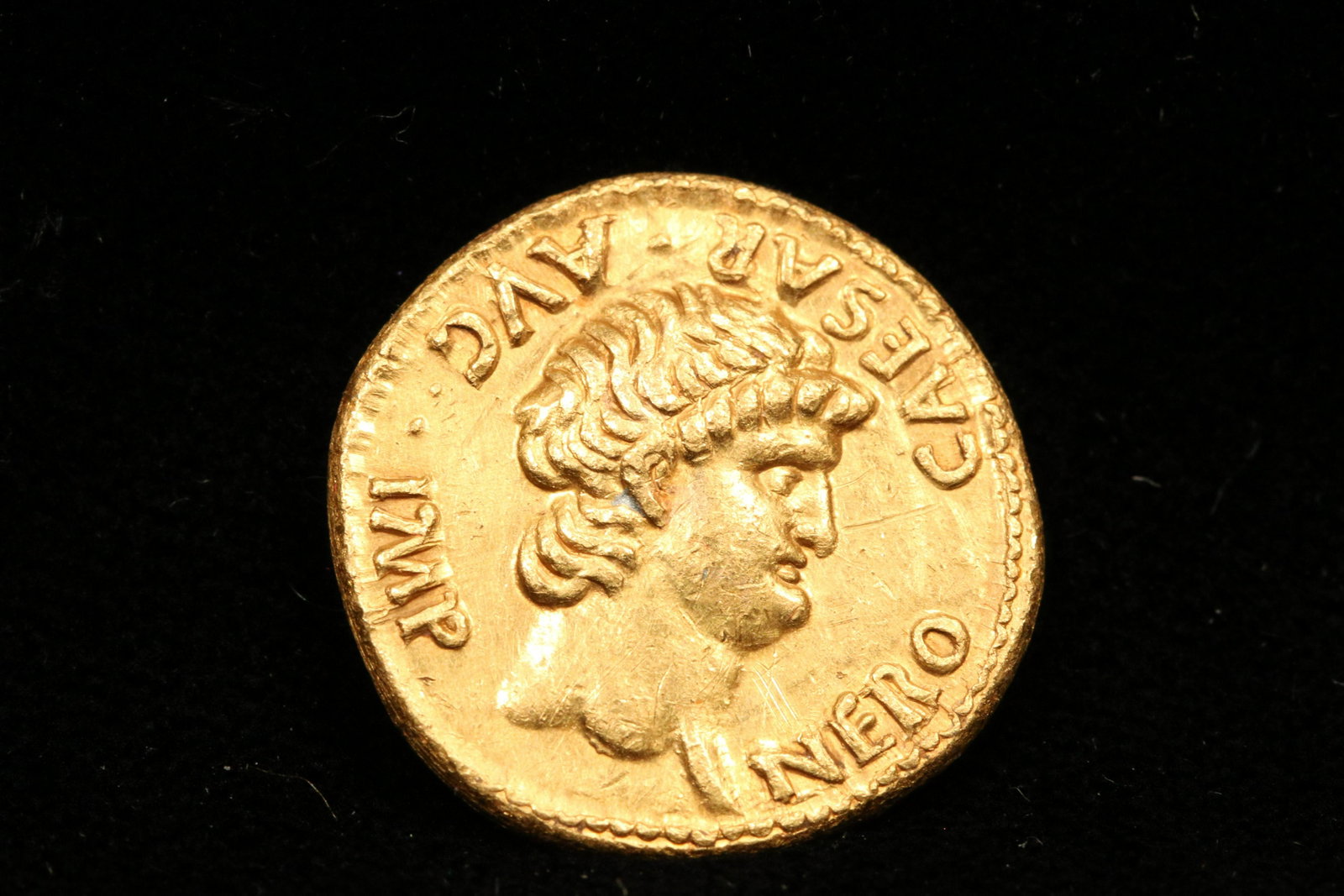 Ancient Nero Coin: A gold (23K) Nero Cesar coin. 3/4" dia.