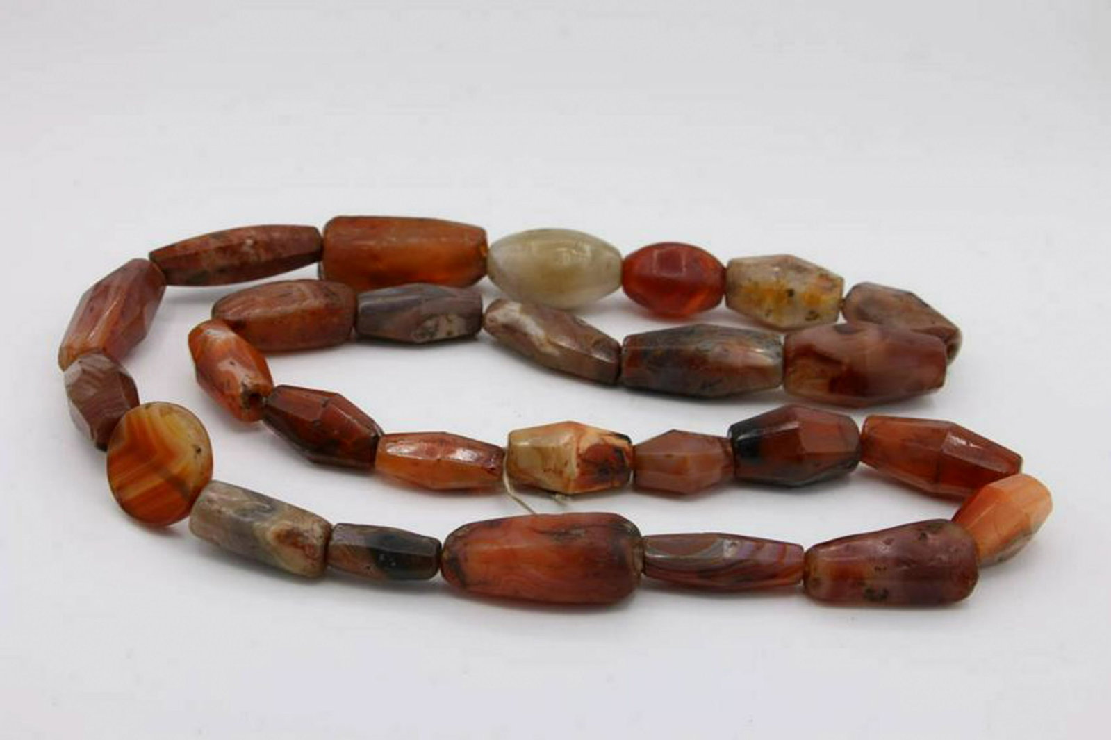 Carnelian Trade Beads: Idar Oberstein carnelian trade beads, 19th century and earlier. 30" L