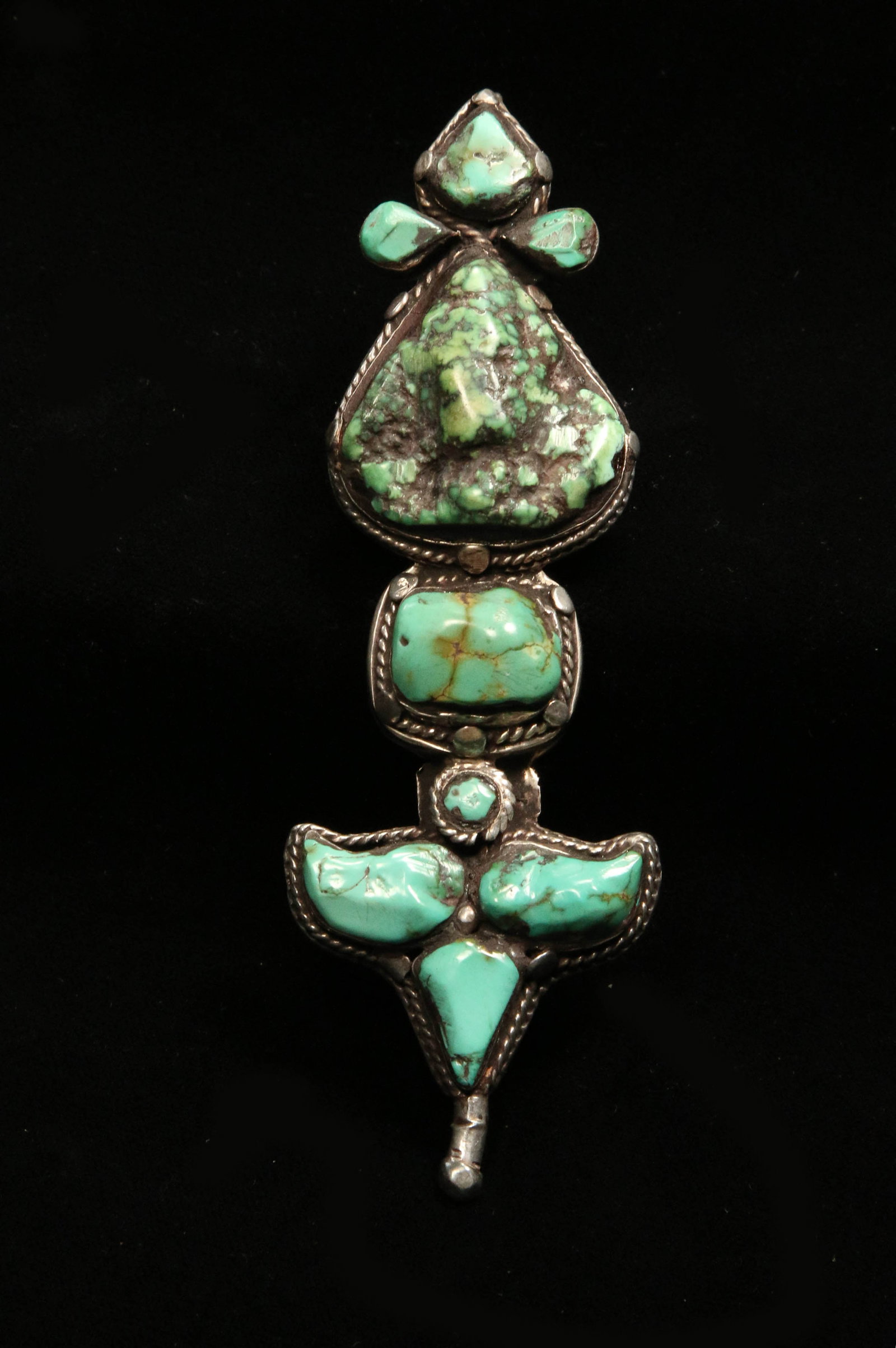 Antique Tibetan Akor Earring/Pendant: A rare Tibetan decoration that was worn close to the ear but because of its weight was traditionally hung on a headress. A loop at the end allowed it to be also worn as a pendant. Face and reverse sid