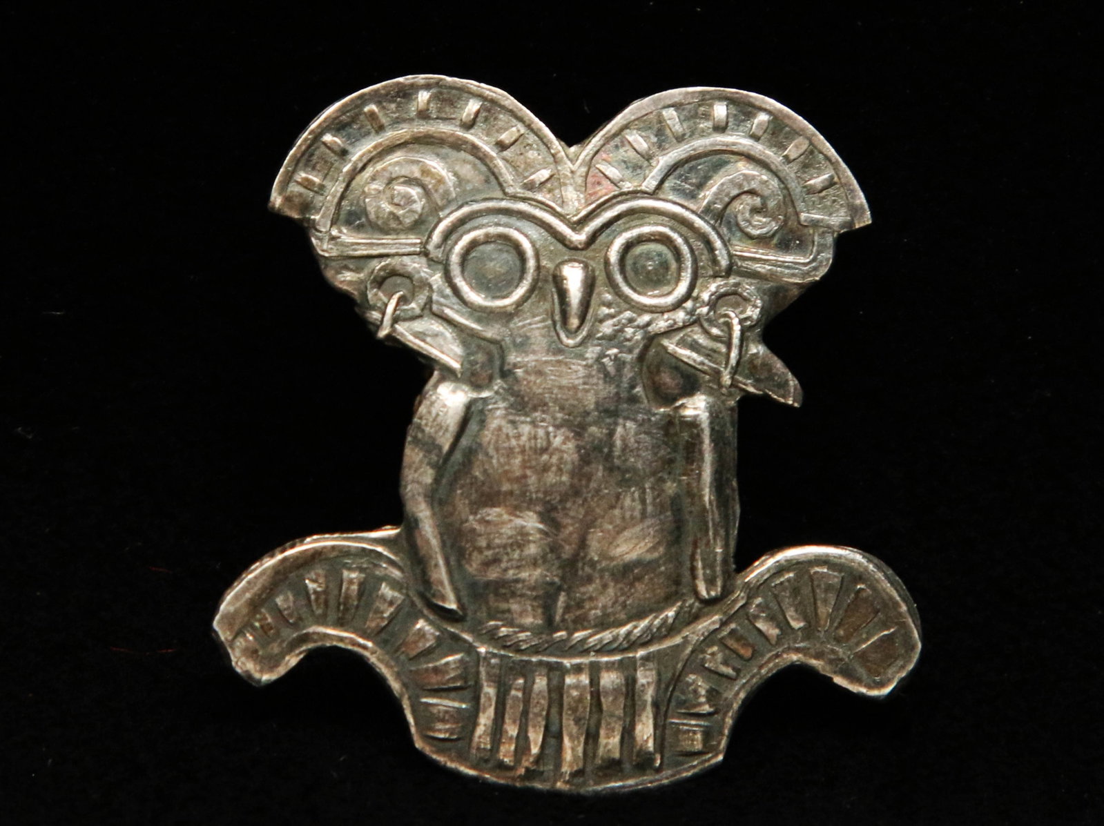900 Silver Owl Lapel Pin: Stylized wise old owl forged in 900 silver and marked on the back. Measures approximately 1.25" x 1.25" and weighs 4.5 grams.