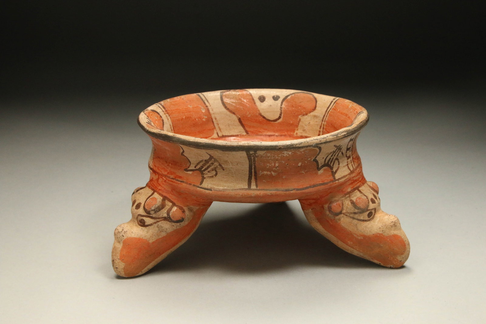 Pre-Columbian Tripod Bowl: A Nicoya tripod bowl with rattle legs shaped as animal faces. 8" Dia.; 1 lb. 5 oz.