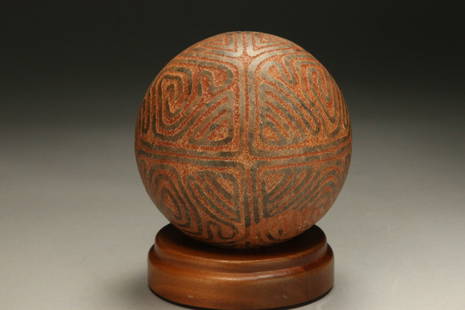 Pre-Columbian Game Ball: A Taino stone game ball incised with geometric designs. 4-1/2" Dia.; 4 lbs. 13 oz. Provenance: Ex collection, New Yori, N.Y.