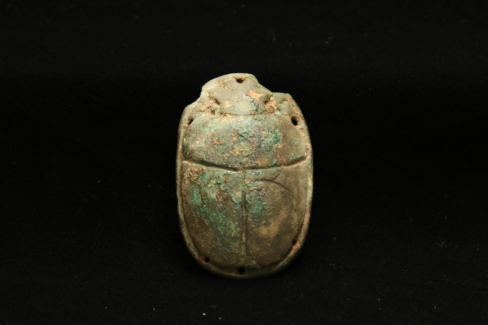Ancient Egyptian Scarab: A large faience scarab with suspension holes.