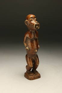 African Art - Bronze Monkey: A large bronze monkey with incised design on cheeks, tongue at mouth. Ivory Coast, 7-1/2" H Provenance; Ex. Thomas Mcnemar collection.