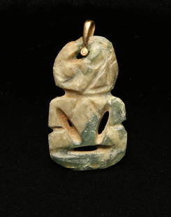 An old Maori Hei-Tiki Pendant: A old Maori carved green stone hei-tiki pendant with 14 kt. gold suspension loop. 1-3/4" H Provenance: Ex collection, New York, NY