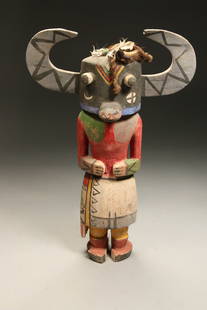 Native American Kachina Doll: A vintage wood Kachina doll, cottonwood, polychrome pigment, fiber and feathers. 15" H x 10" W