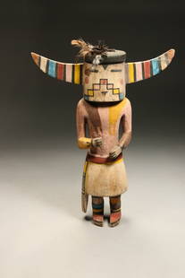 Native American Kachina Doll: A vintage cottonwood Kachina doll, polychrome pigmentation, fiber, feathers. 14" H x 10-1/2" W