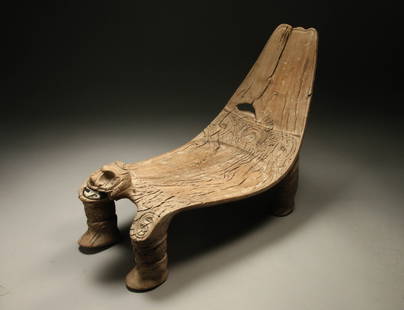 Pre-Columbian Taino Wood Duho: A rare wood Duho stool, hand carved with projecting zoomorphic figure at front with manatee bone teeth. Incised designs on carved seat. Four carved feet as base. 18" L x 8" W x 12-1/2" H 