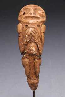 Pre-Columbian Figure: A small zemi figure with folded hands at chest, design on reverse. calcified bone. 3-1/8" L Provenance: Ex private collection, Bronx, NY