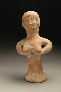 Judahite Pillar Figurine: Salmon color solid pottery standing female idol, holding both hands under breasts. See equivalent Metropolitan Museum of Art. 6-3/4" H Provenance: Ex collection, New Hampshire