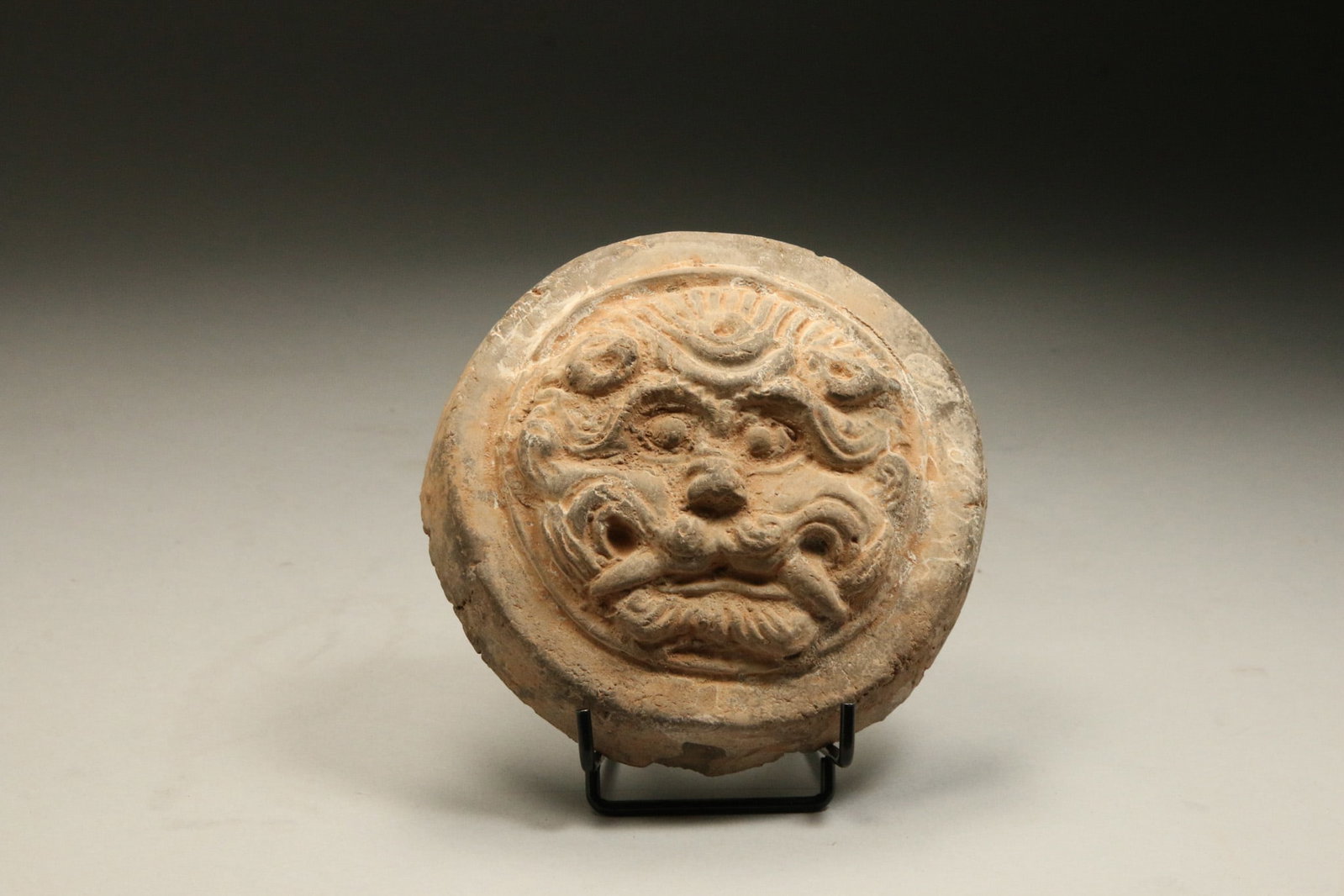 Chinese Jar Lid - Ming Dynasty: A terracotta Ming Dynasty vessel lid in the shape of a fanged animal. 4-1/2" Dia.
