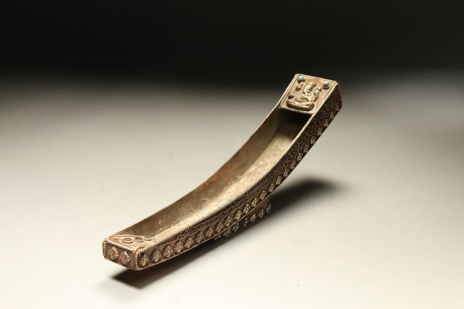 Antique Silverplate Stick Incense Burner: A silver over copper stick incense burner, India, with Ganesh flanked by turquoise beads.