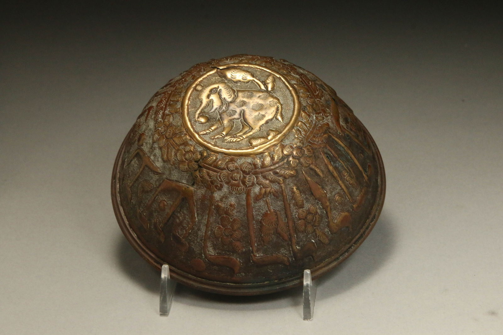 Antique Bronze Judaica Bowl: An old bronze bowl with Yiddish writing, floral motifs and elephant on bottom. Hand hammered. 5" W x 2" H